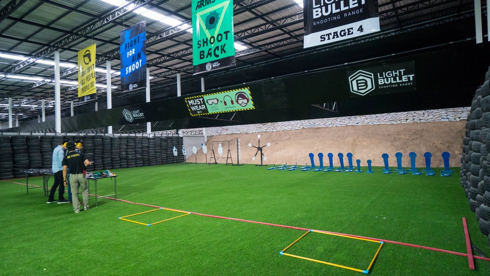 IPSC-style practical shooting stage with silhouette targets at Light Bullet